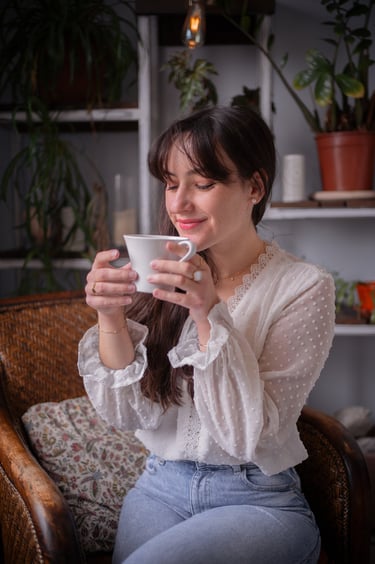a woman which is happy with her coffee