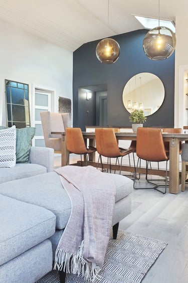 Open plan living dining, teal accent wall, globe pendants, cathedral ceiling, Medford MA, Erica Fossati Design