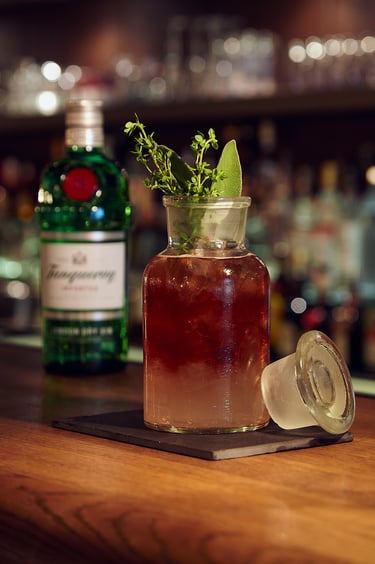 A gin cocktail with sage and thyme.