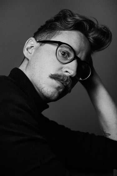 A black and white headshot of Grant Price.