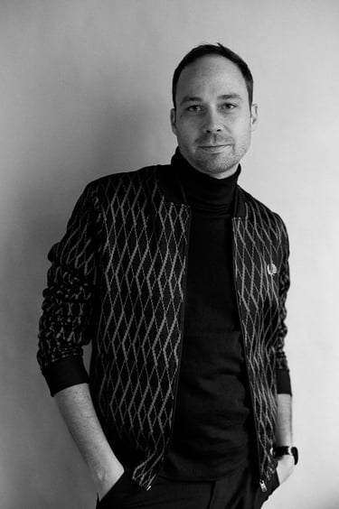 Man in a jacket with a turtle neck.