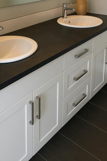 white vanity euro-style with two sinks and black countertop