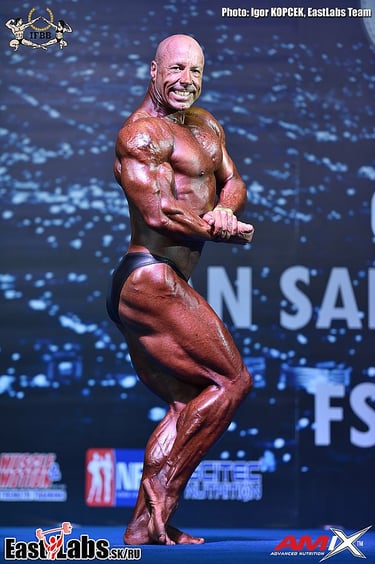 Rohan J. Reid 6x Mr Australia onstage at World Championships—bodybuilding contest prep coach