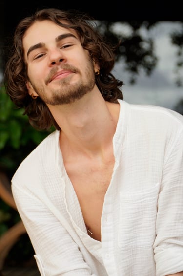 a man with a beard and a white shirt