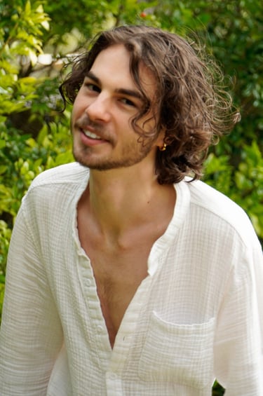 a man with a beard and a white shirt