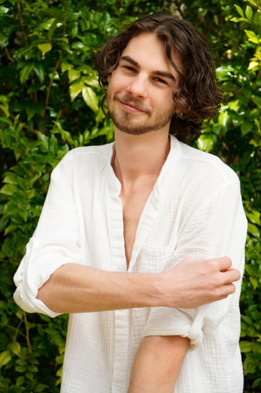 a man with a beard and a white shirt