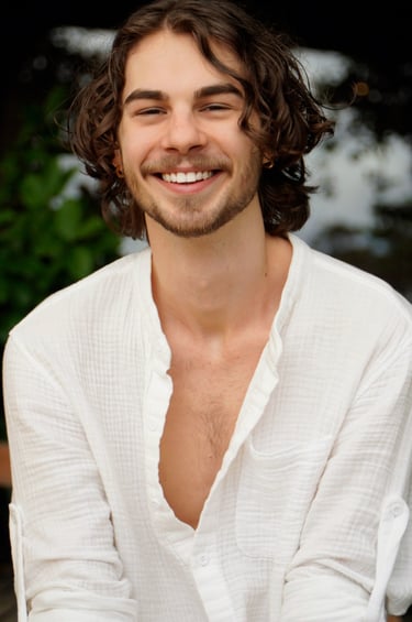 a man with a beard and a white shirt
