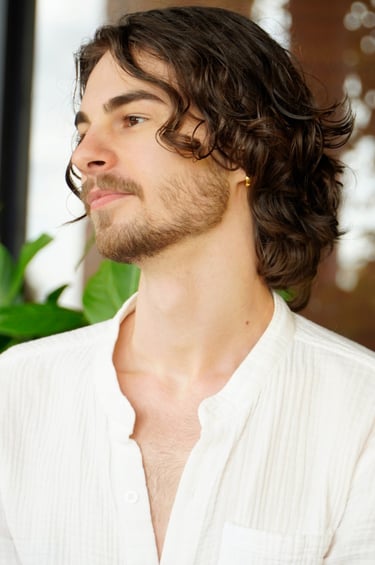 a man with a beard and a white shirt