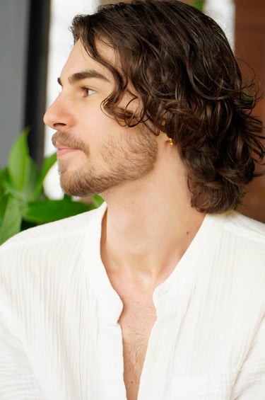 a man with a beard and a white shirt