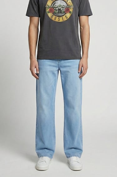 a man standing in front of a white wall