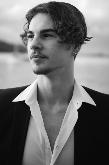 a man in a suit and a white shirt