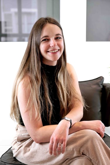 a woman sitting on a couch with and smiling