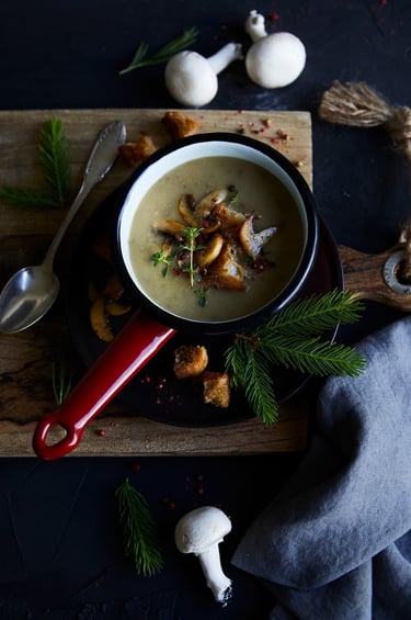 a bowl of soup with mushrooms and mushrooms