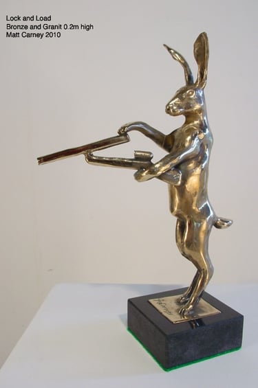 a statue of a rabbit with a gun in its hand