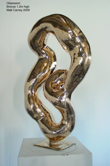 a highly polished reflective abstract bronze sculpture 