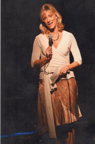 Angie Crouch public speaking on stage in Los Angeles