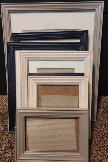 Empty picture frames stacked together