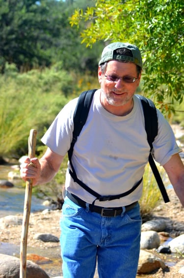 Crossing streams and bounding boulders during a trek to the summit