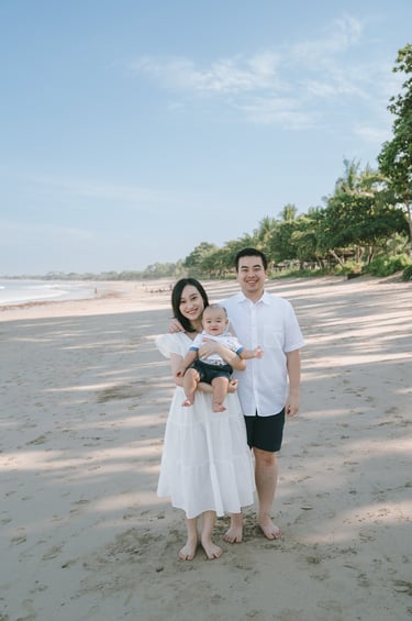 Family walking together on the beach at Intercontinental Jimbaran during a relaxed Bali family photography session
