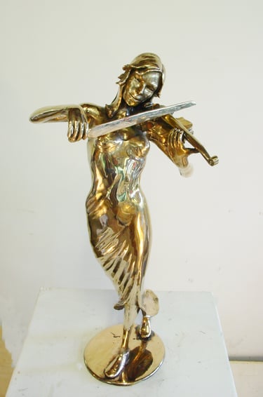 a statue of a woman playing the violin
