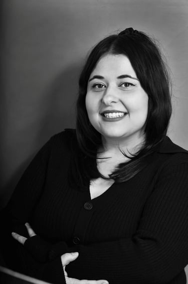 Black and white professional headshot of Emma Santos 