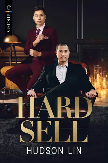 Book cover for Hard Sell by Hudson Lin featuring two stylish Asian men in suits in a luxury lounge.
