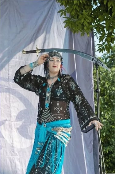 Sword Bellydancer Shahravar in Black and silver Tulle Bi Telli caftan  with salt city dance