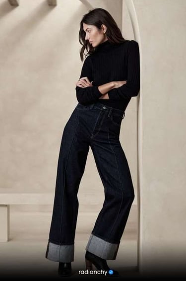 a woman in a black top and jeans jeans