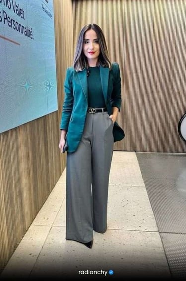 a woman in a green jacket and pants