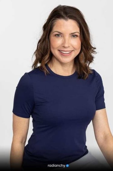 a woman in a blue shirt and a white shirt