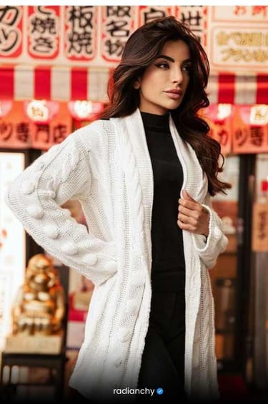 a woman in a white cardigand cardigand sweater