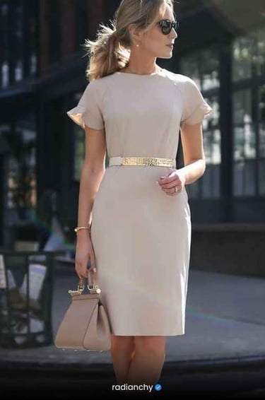 a woman in a white dress and sunglasses