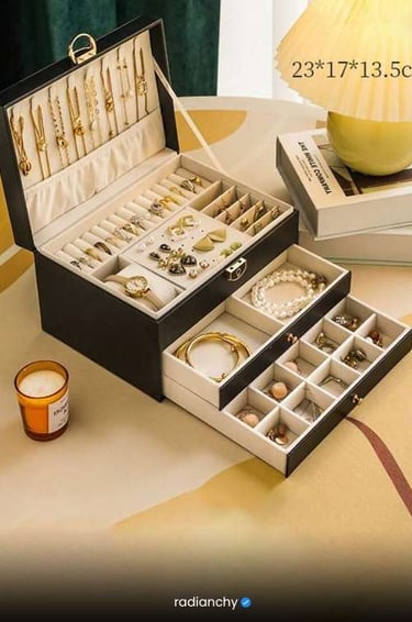 a jewelry box with a candle and a candle