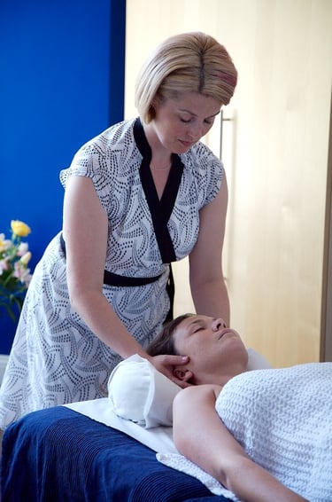 Julia massaging a patient. Tuina