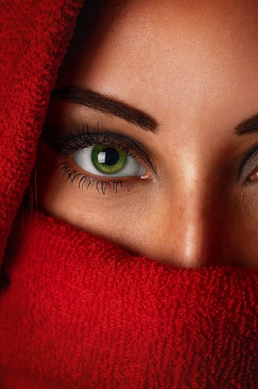 A close-up image of a woman with upturned eye shape.