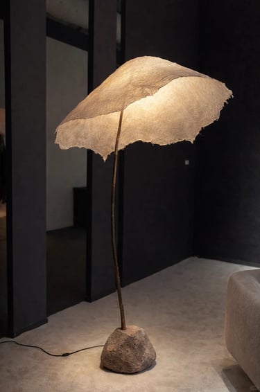 Modern outdoor floor lamp beside a lounge chair, creating a calm balcony lighting atmosphere.