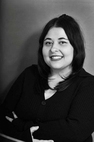 Black and white professional headshot of Emma Santos 