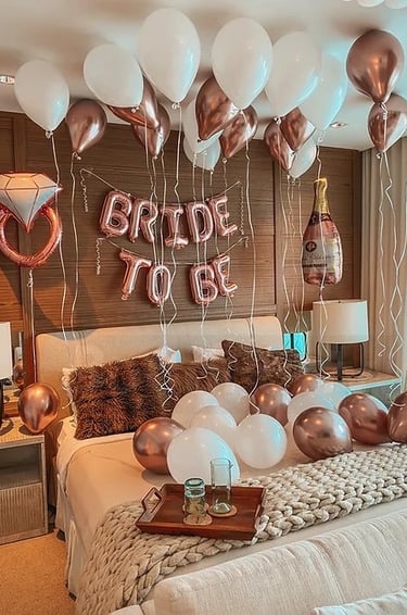 Memorable bridal surprise room with shimmering balloons and luxury “Bride to Be” decor.