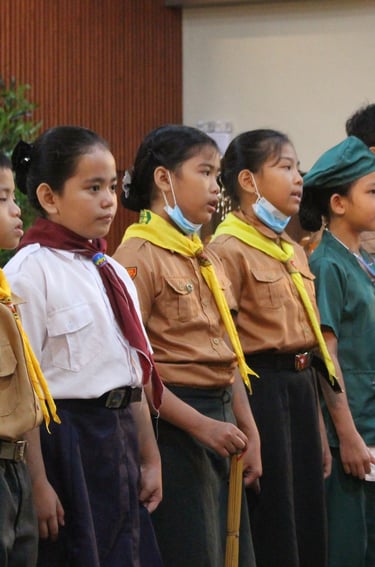 Group of elementary scout students standing in line