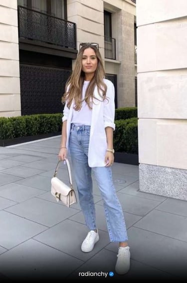 a woman in jeans and a white shirt
