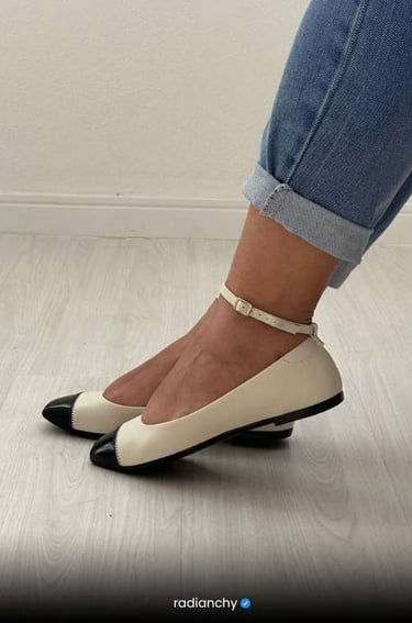 a woman's feet in jeans and heels