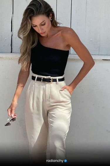 a woman in a black top and pants