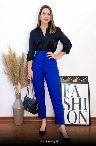 a woman in a black shirt and blue pants