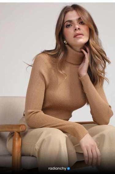 a woman in a tan sweater and tan pants