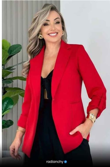 a woman in a red jacket and black dress