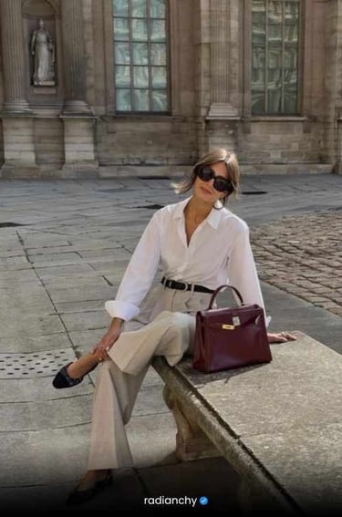 a woman in a striped shirt and jeans is holding a basket bag