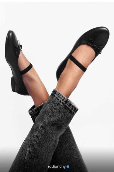 a woman's legs and feet in jeans and heels