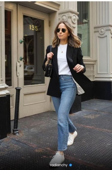 a woman in a white shirt and jeans jeans and a black blazer jacket