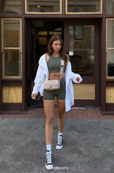 a woman in a sports bra top and shorts
