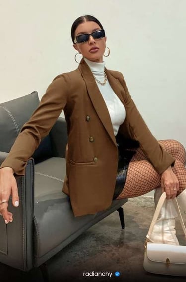 a woman in a brown jacket and stockings